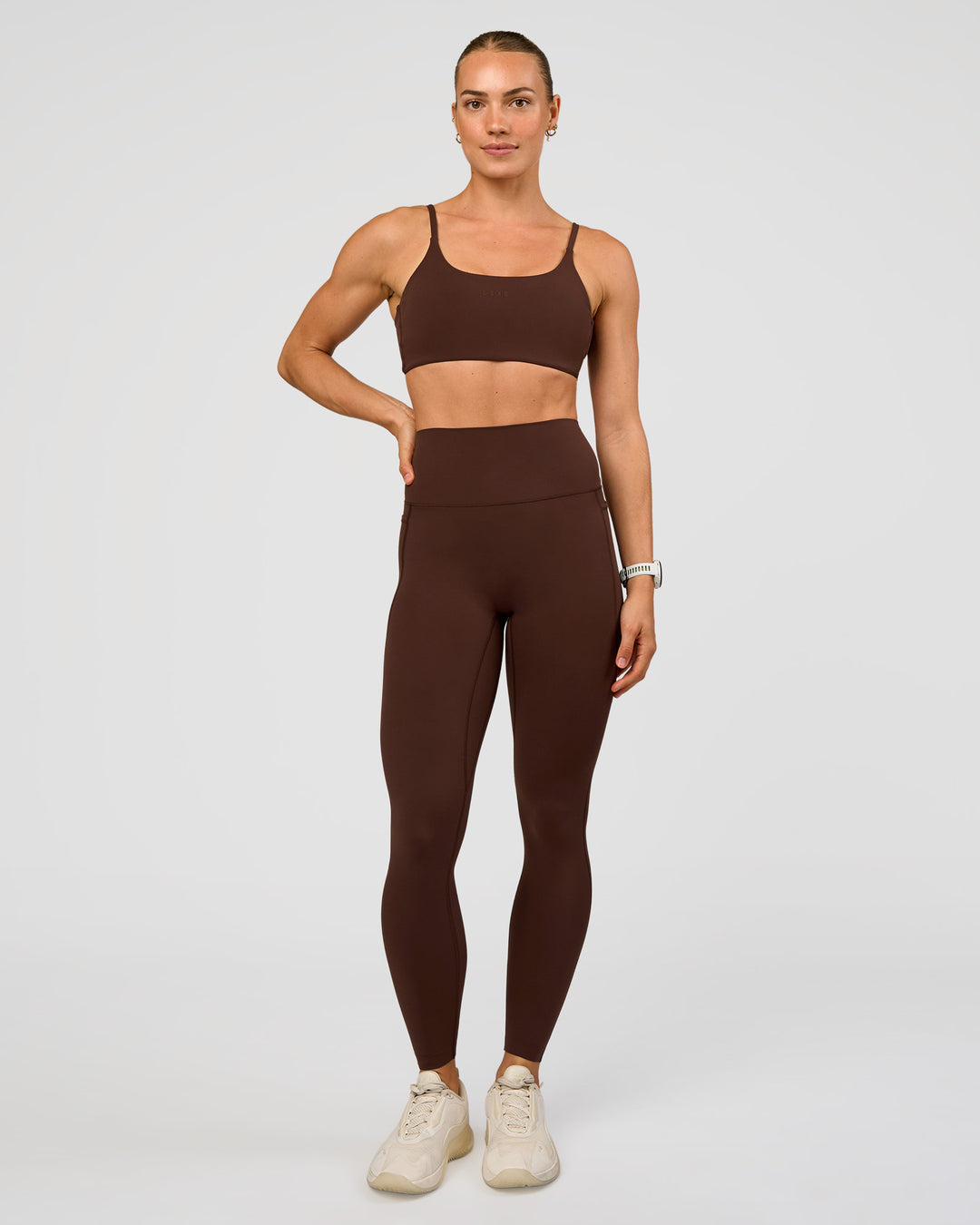 Woman wearing Elixir Ultra High-Rise Full Length Legging Pockets - Hot Chocolate | Model:Maja | Size:XS