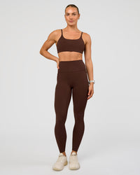 Woman wearing Elixir Ultra High-Rise Full Length Legging Pockets - Hot Chocolate | Model:Maja | Size:XS