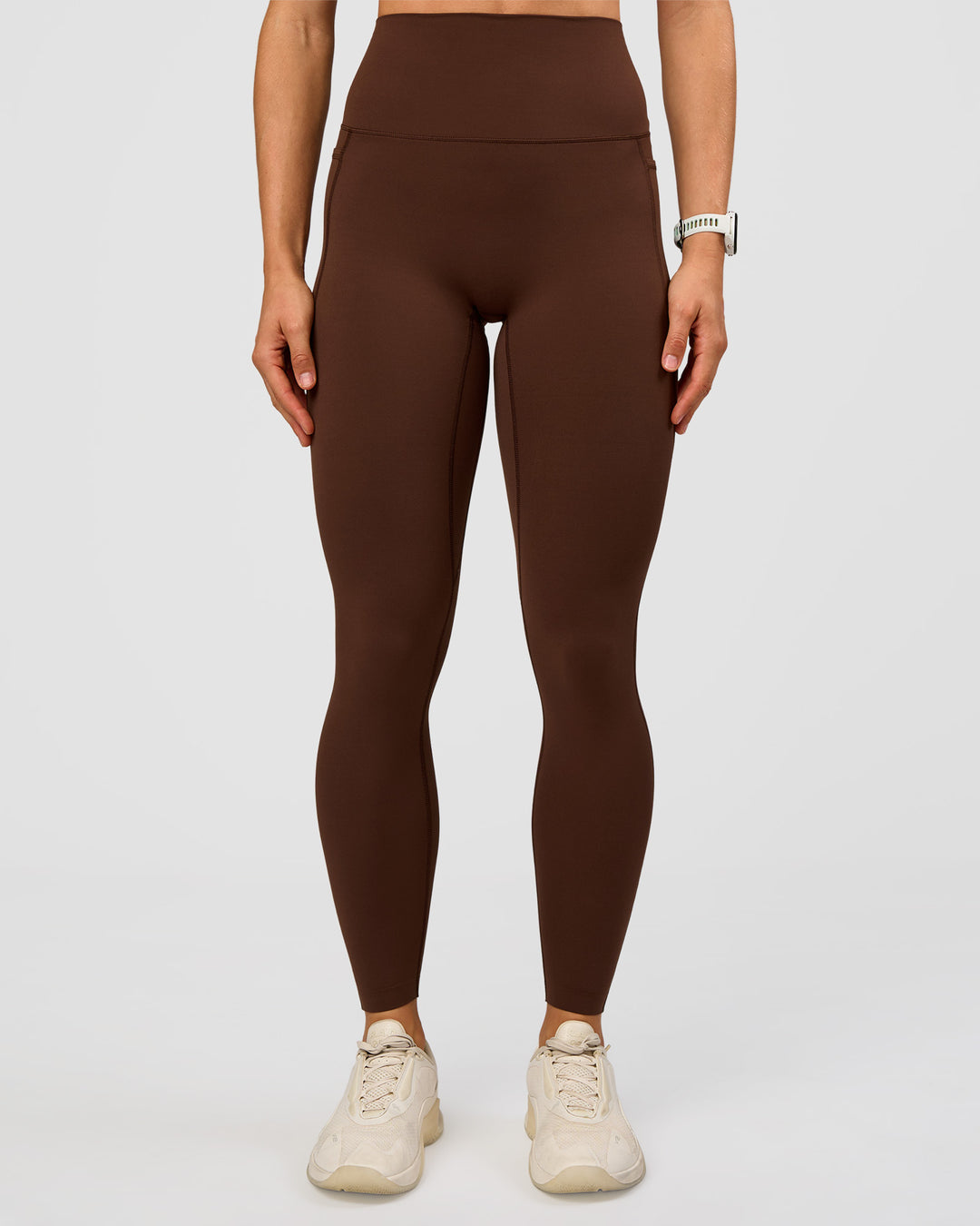 Woman wearing Elixir Ultra High-Rise Full Length Legging Pockets - Hot Chocolate | Model:Maja | Size:XS
