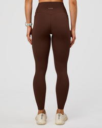Woman wearing Elixir Ultra High-Rise Full Length Legging Pockets - Hot Chocolate | Model:Maja | Size:XS