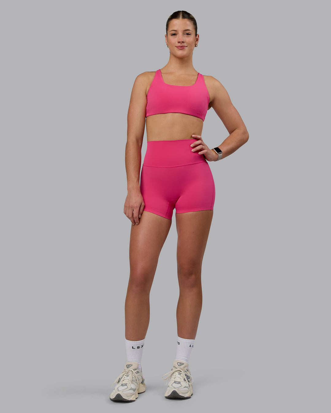 Woman wearing Elixir Ultra High-Rise 4&quot; Short - Pink Flash | Model:Chloe | Size:XS