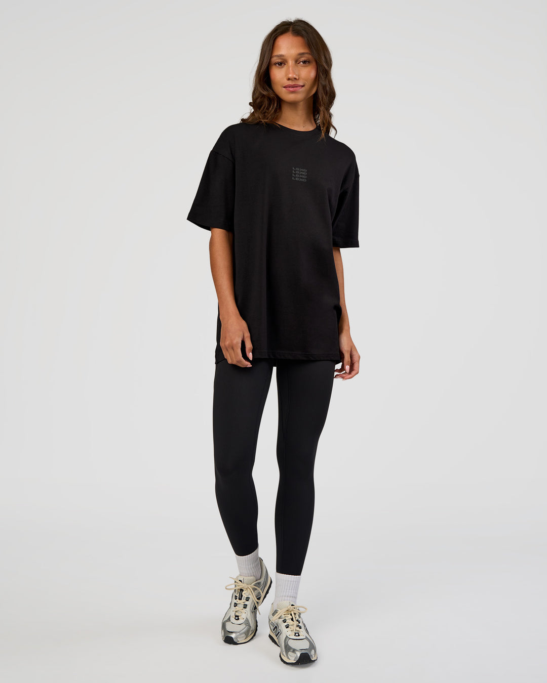Woman wearing Everyday Elevation FLXCotton Oversized Tee - Black-Black | Model:Dakota | Size:XS
