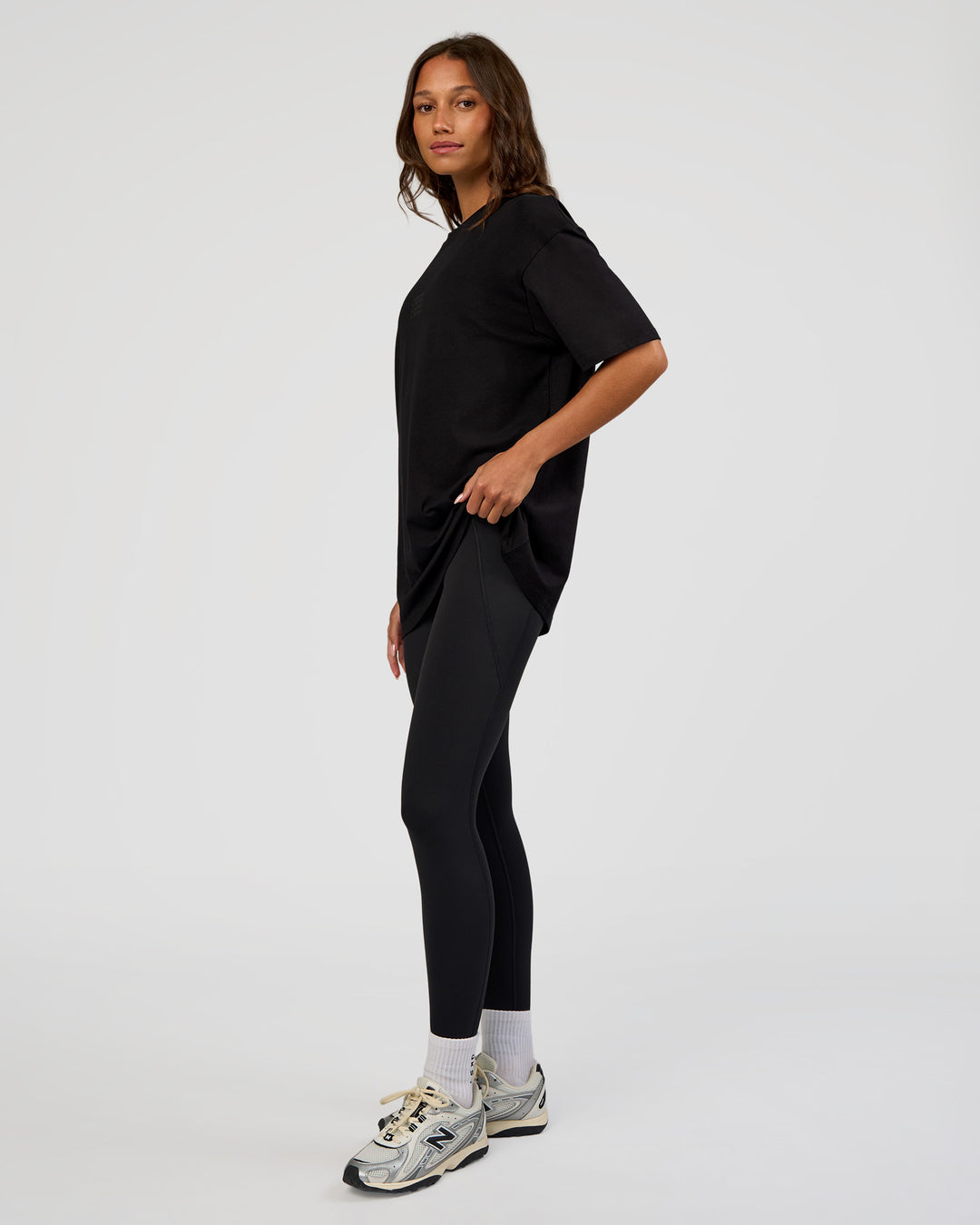 Woman wearing Everyday Elevation FLXCotton Oversized Tee - Black-Black | Model:Dakota | Size:XS