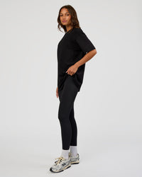 Woman wearing Everyday Elevation FLXCotton Oversized Tee - Black-Black | Model:Dakota | Size:XS