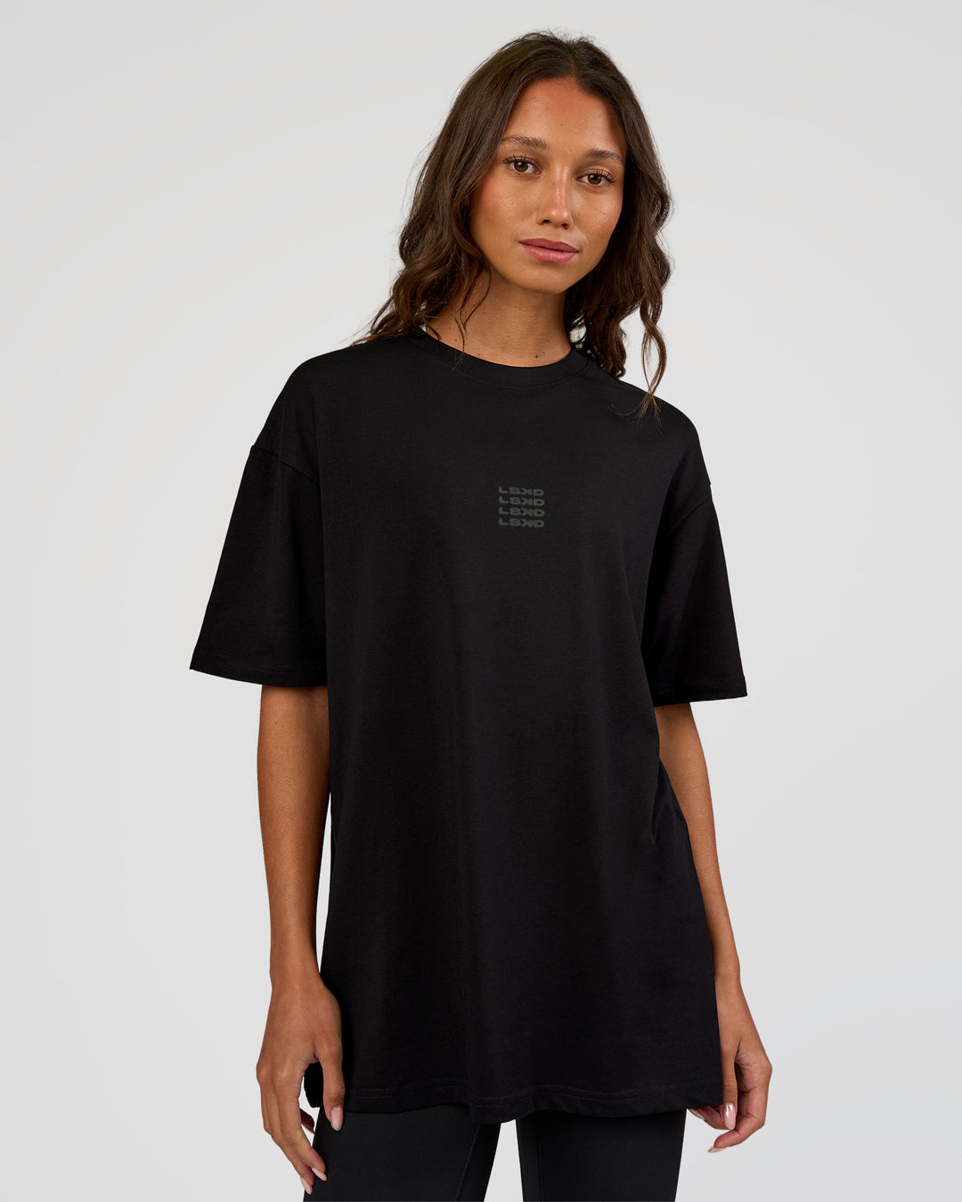 Woman wearing Everyday Elevation FLXCotton Oversized Tee - Black-Black | Model:Dakota | Size:XS