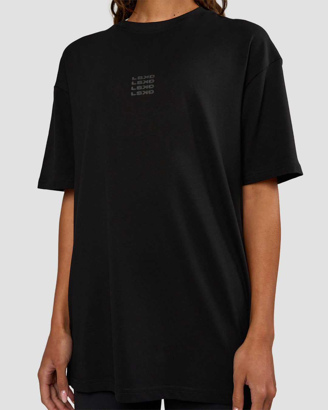 Woman wearing Everyday Elevation FLXCotton Oversized Tee - Black-Black | Model:Dakota | Size:XS