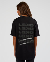 Woman wearing Everyday Elevation FLXCotton Oversized Tee - Black-Black | Model:Dakota | Size:XS