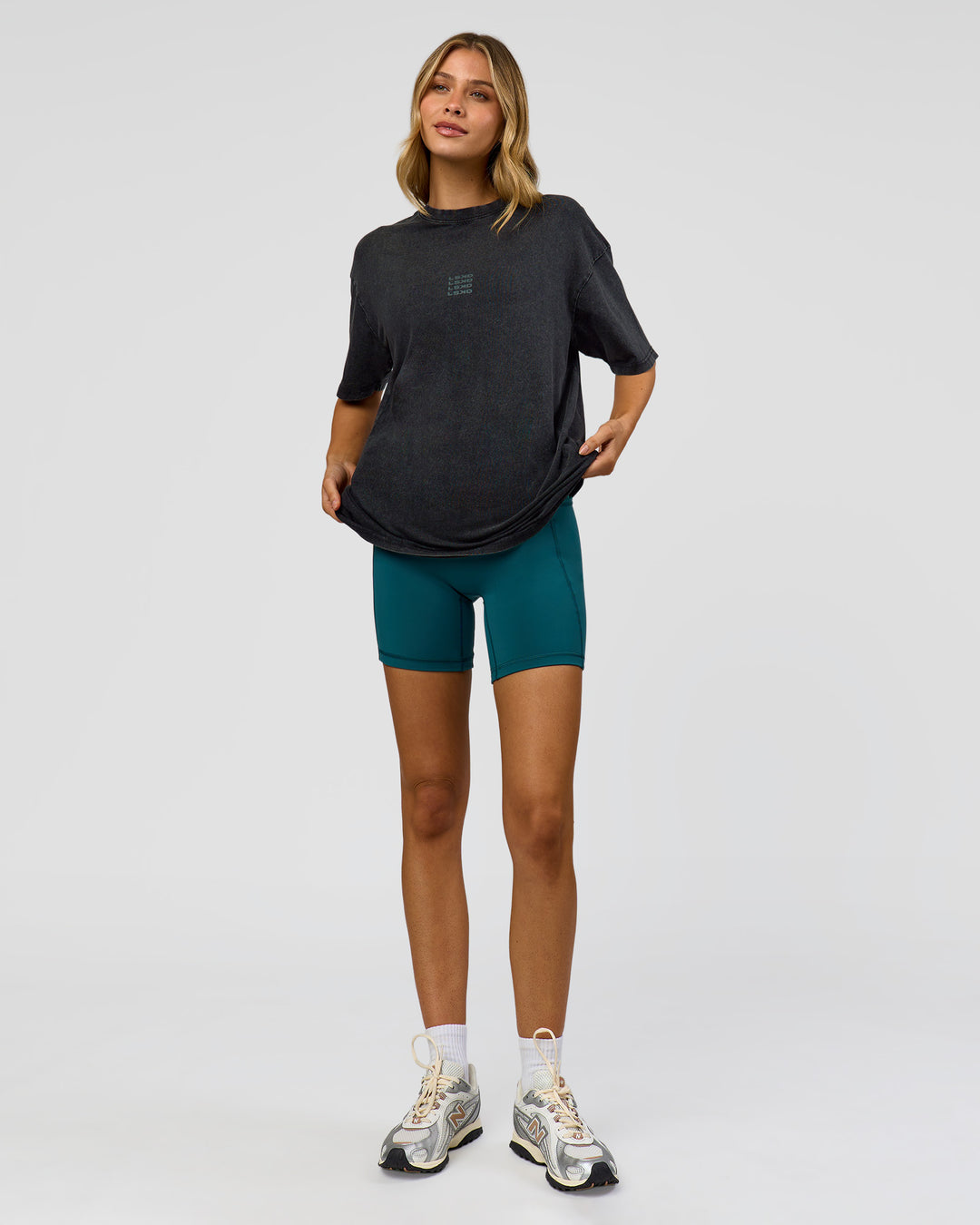 Woman wearing Everyday Elevation FLXCotton Oversized Tee - Black Washed-Carbon Green | Model:Leilani | Size:XS