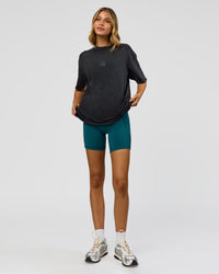 Woman wearing Everyday Elevation FLXCotton Oversized Tee - Black Washed-Carbon Green | Model:Leilani | Size:XS