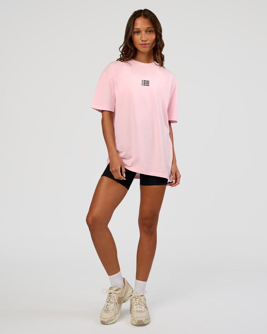 Woman wearing Everyday Elevation FLXCotton Oversized Tee - Marshmallow-Black | Model:Dakota | Size:XS