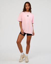 Woman wearing Everyday Elevation FLXCotton Oversized Tee - Marshmallow-Black | Model:Dakota | Size:XS