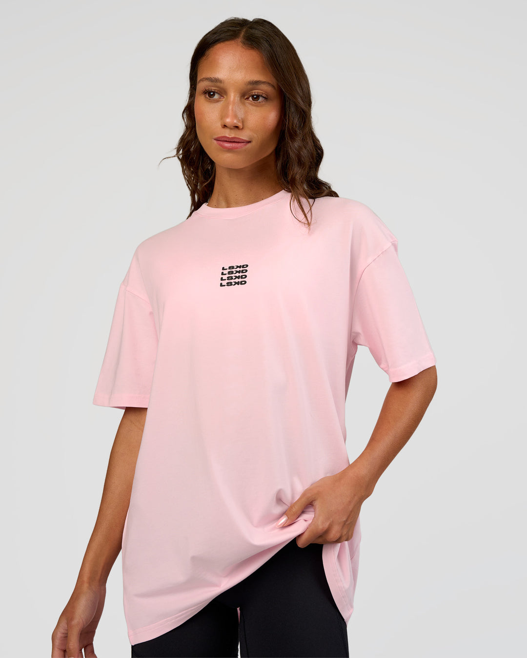 Woman wearing Everyday Elevation FLXCotton Oversized Tee - Marshmallow-Black | Model:Dakota | Size:XS