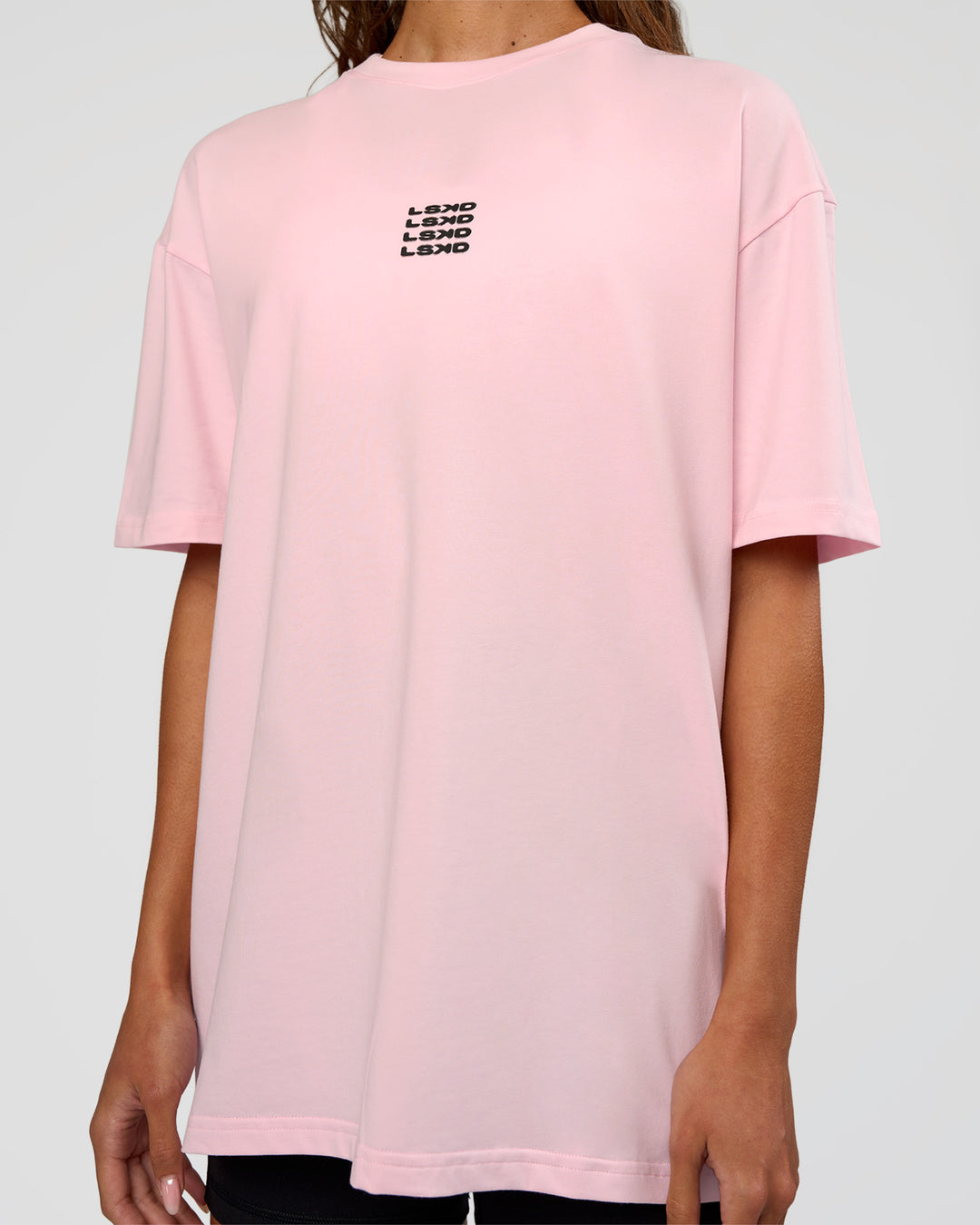 Woman wearing Everyday Elevation FLXCotton Oversized Tee - Marshmallow-Black | Model:Dakota | Size:XS