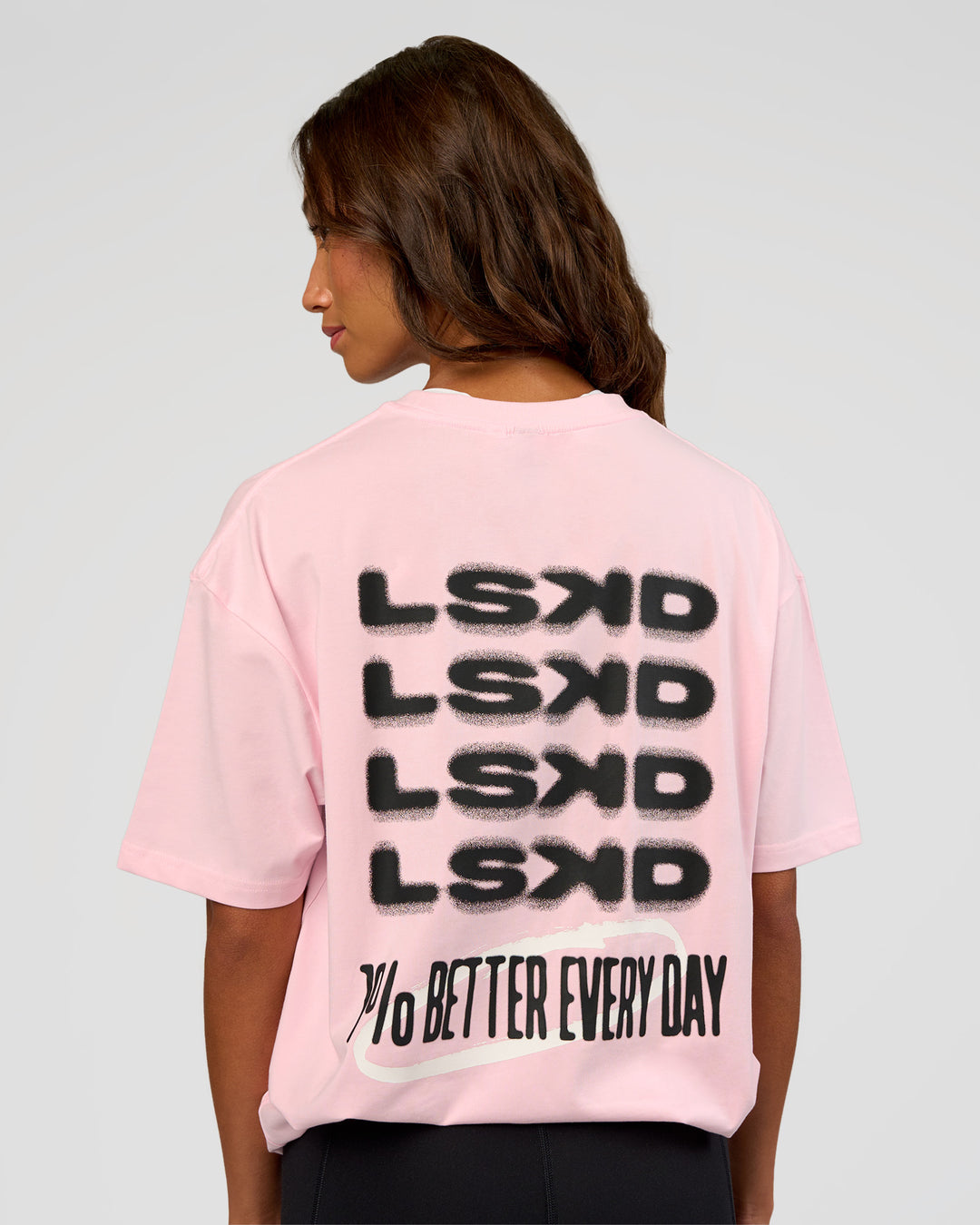 Woman wearing Everyday Elevation FLXCotton Oversized Tee - Marshmallow-Black | Model:Dakota | Size:XS
