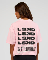 Woman wearing Everyday Elevation FLXCotton Oversized Tee - Marshmallow-Black | Model:Dakota | Size:XS