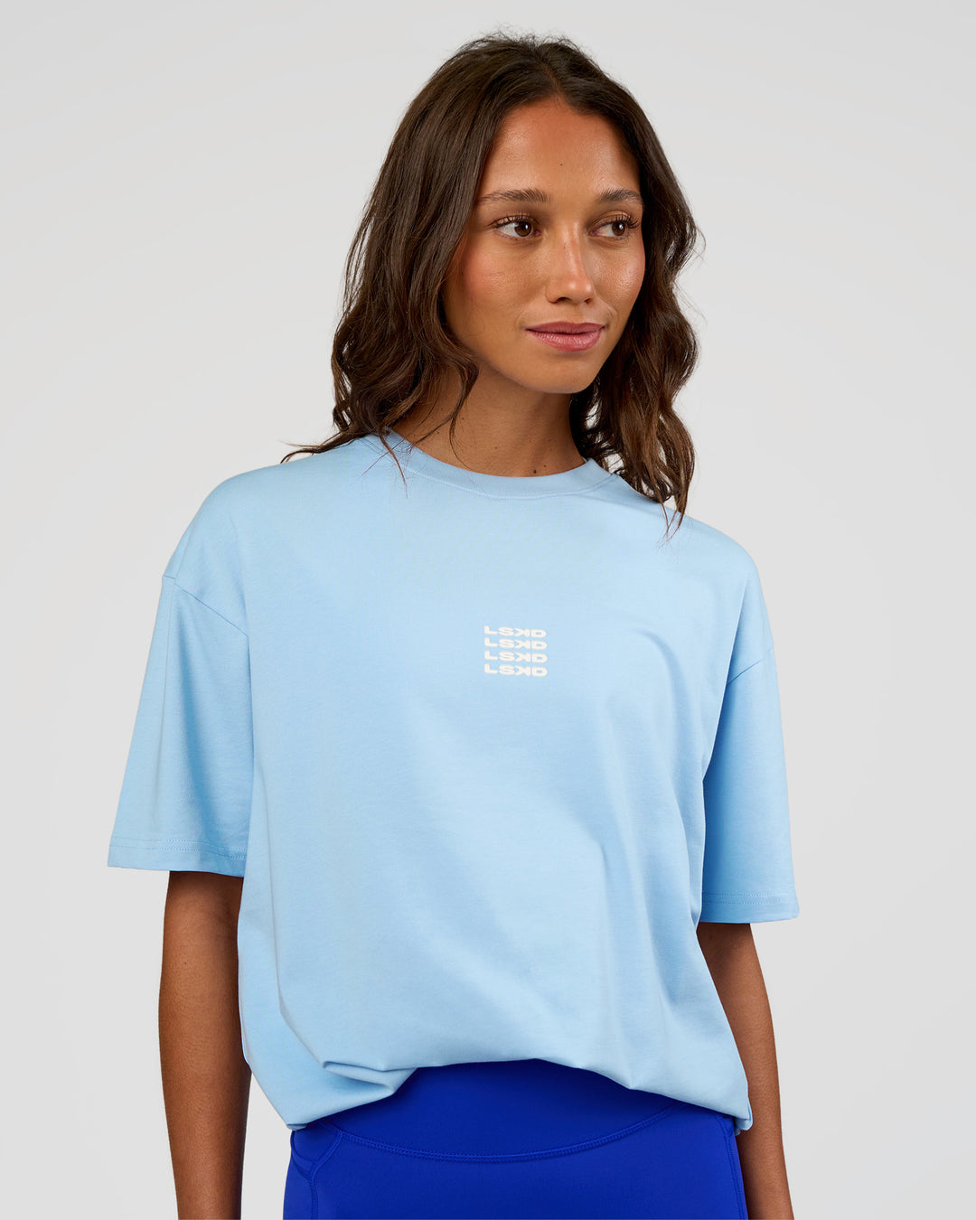 Woman wearing Everyday Elevation FLXCotton Oversized Tee - Open Air-Off White | Model:Dakota | Size:XS