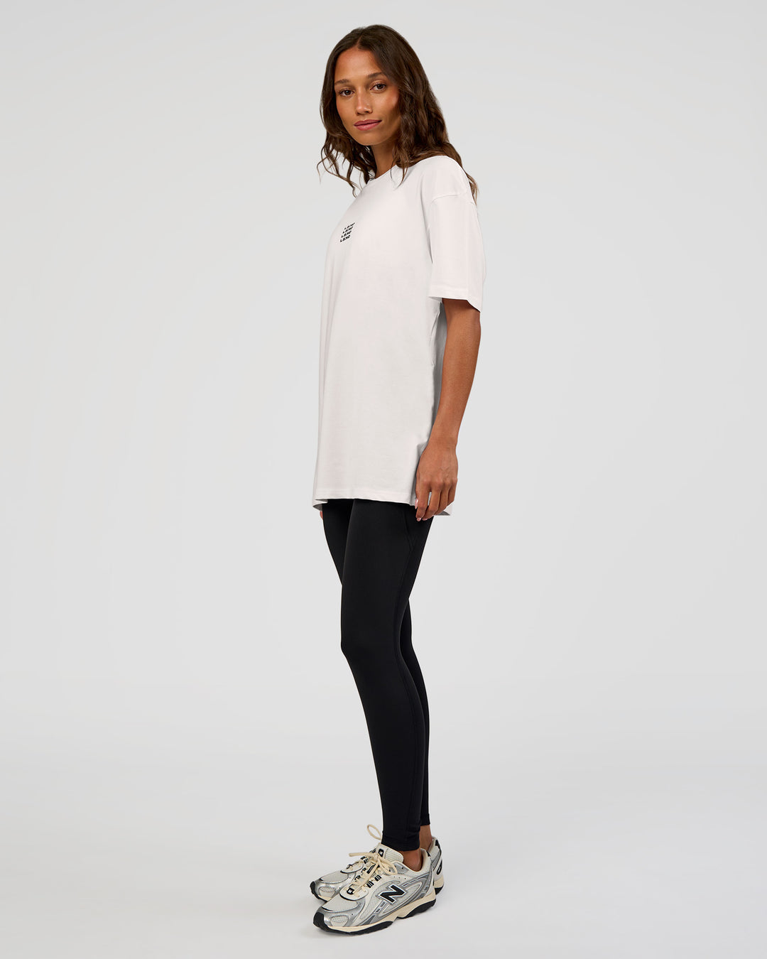 Woman wearing Everyday Elevation FLXCotton Oversized Tee - White-Carbon Green | Model:Dakota | Size:XS