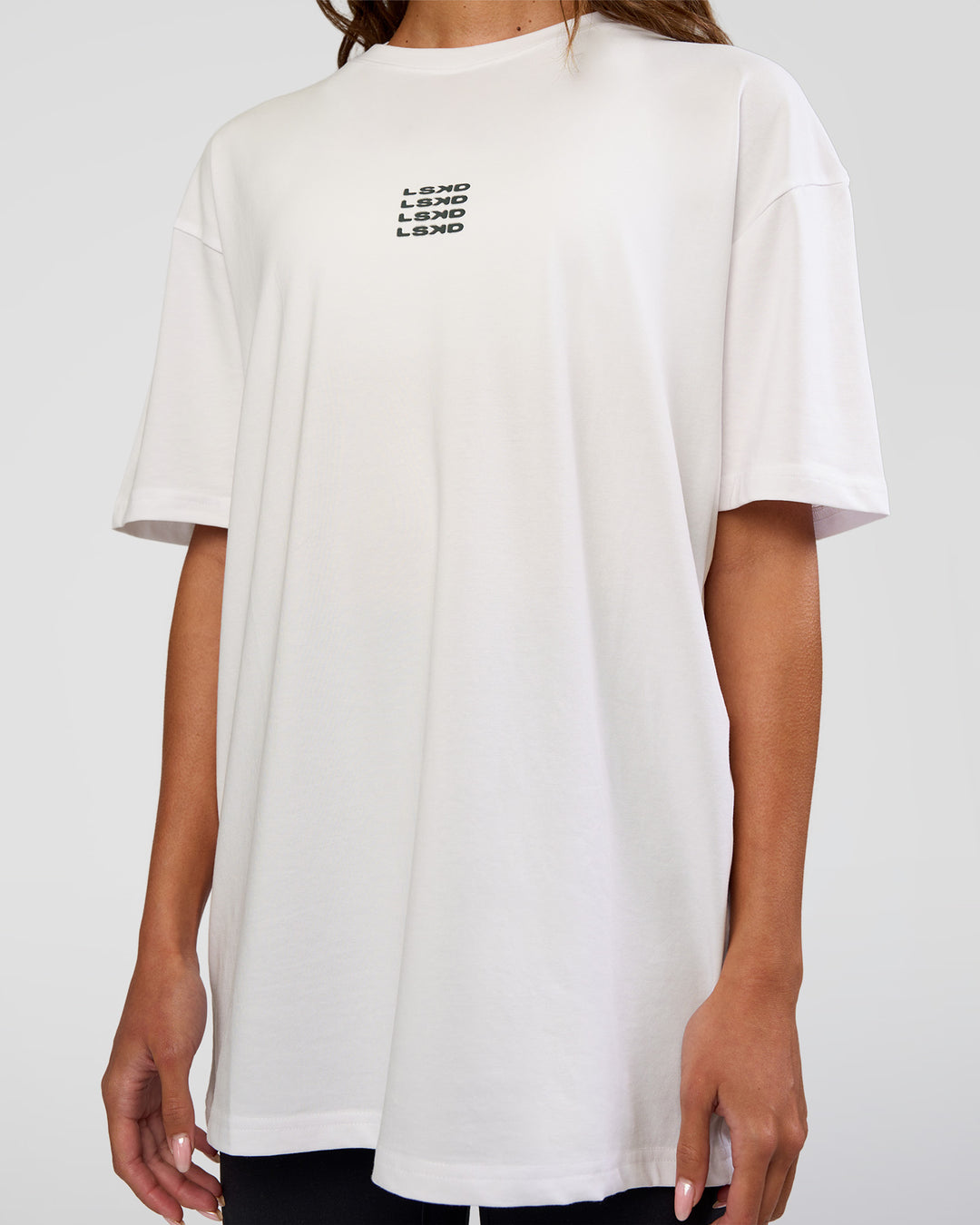 Woman wearing Everyday Elevation FLXCotton Oversized Tee - White-Carbon Green | Model:Dakota | Size:XS