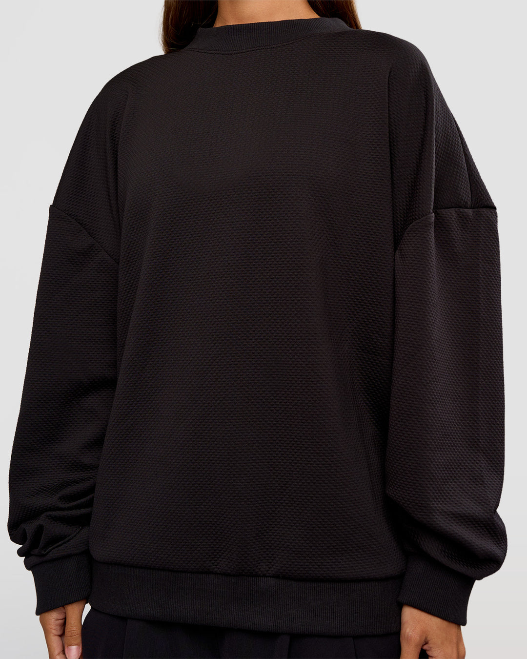 Woman wearing Everyday Elevation Waffle Oversized Sweater - Black | Model:Brylee | Size:XS