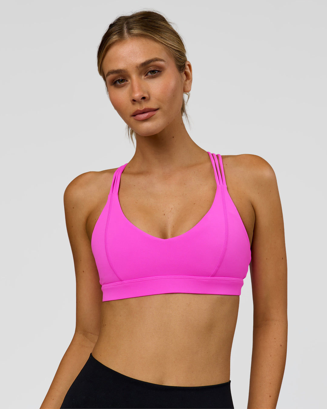 Woman wearing Flash Sports Bra - Ultra Fuchsia | Model:Leilani | Size:XS