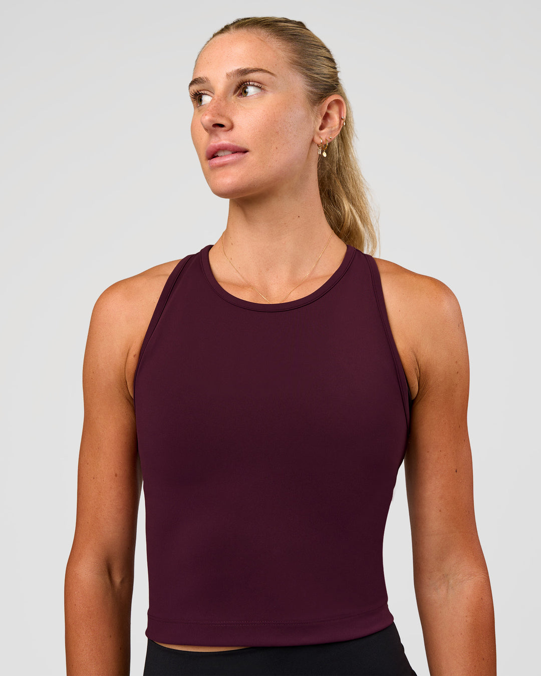 Woman wearing Flow Performance Tank 2.0 - Cherry Lacquer | Model:Emelia | Size:XS
