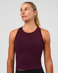 Woman wearing Flow Performance Tank 2.0 - Cherry Lacquer | Model:Emelia | Size:XS