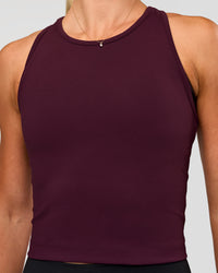 Woman wearing Flow Performance Tank 2.0 - Cherry Lacquer | Model:Emelia | Size:XS
