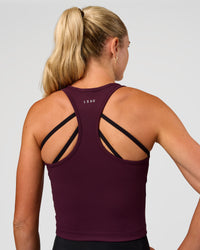 Woman wearing Flow Performance Tank 2.0 - Cherry Lacquer | Model:Emelia | Size:XS