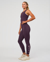 Woman wearing Flow Performance Tank 2.0 - Midnight Plum | Model:Emelia | Size:XS