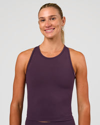 Woman wearing Flow Performance Tank 2.0 - Midnight Plum | Model:Emelia | Size:XS