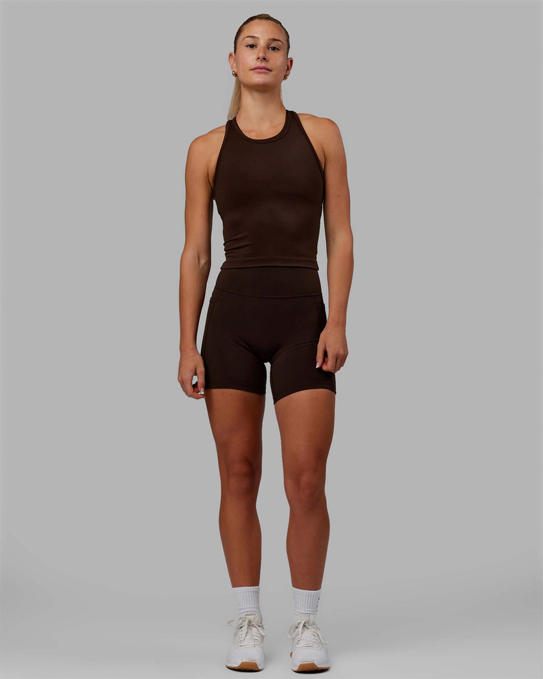 Woman wearing Flow Performance Tank - Dark Chocolate