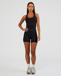Woman wearing Flow Rib Scoop Neck Tank - Black | Model:Brylee | Size:XS