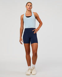 Woman wearing Flow Scoop Neck Performance Tank - Blue Aura | Model:Emelia | Size:XS