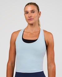 Woman wearing Flow Scoop Neck Performance Tank - Blue Aura | Model:Emelia | Size:XS