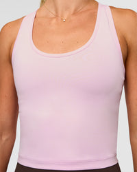Woman wearing Flow Scoop Neck Performance Tank - Marshmallow | Model:Emelia | Size:XS