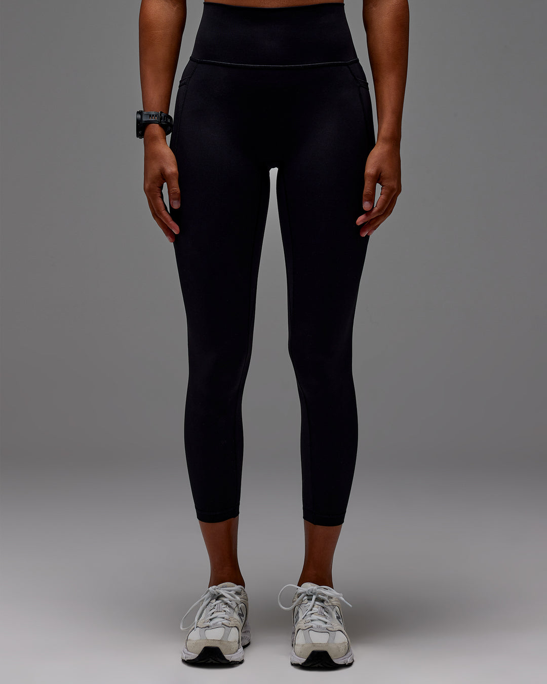 Woman wearing Fusion Ultra High-Rise 7/8 Legging Pockets - Black | Model:Txai | Size:XS