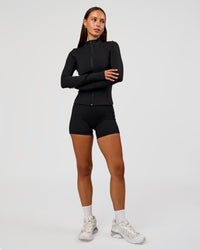 Woman wearing Fusion Active Jacket - Black | Model:Brylee | Size:XS
