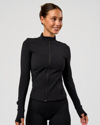 Woman wearing Fusion Active Jacket - Black | Model:Brylee | Size:XS