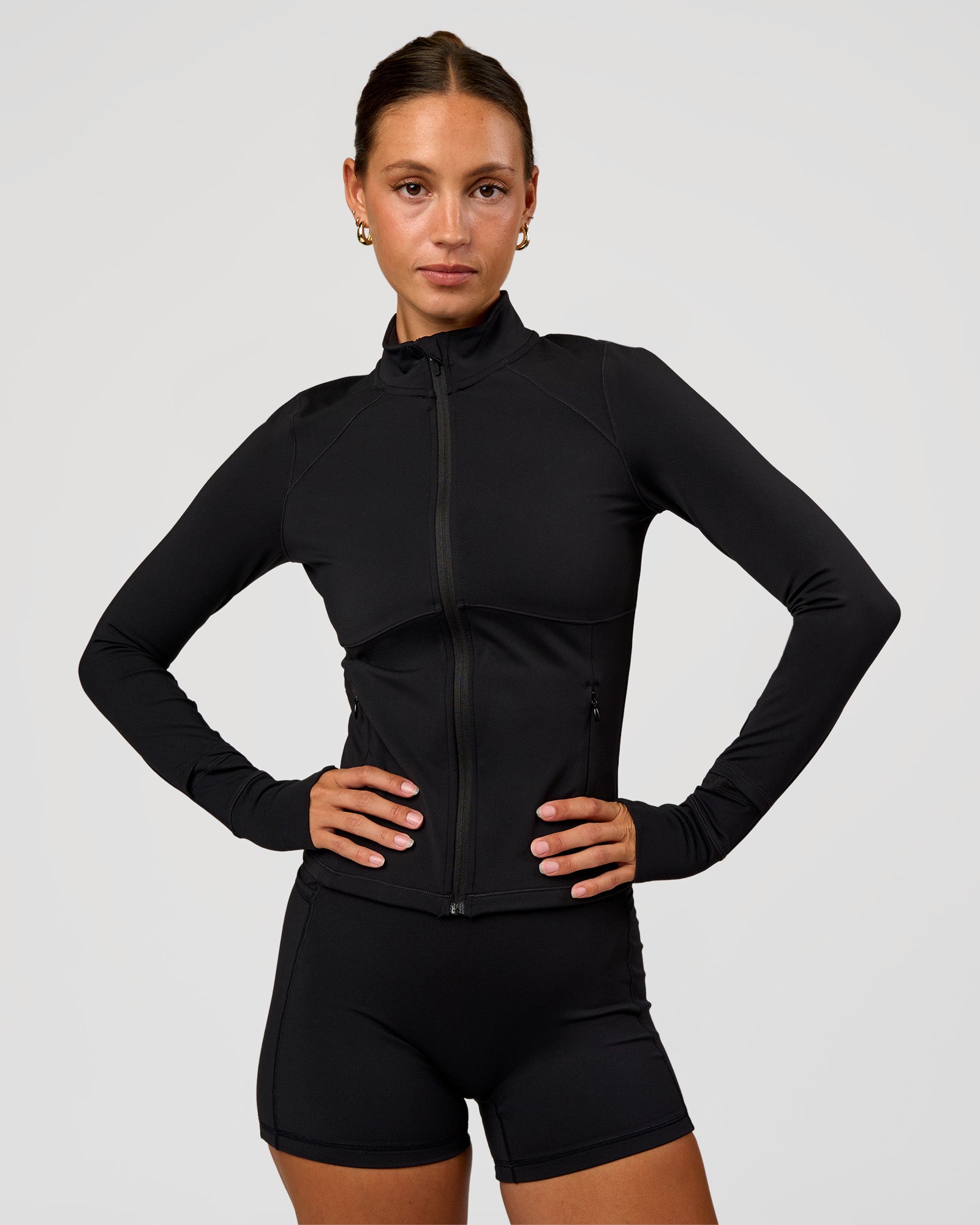 Woman wearing Fusion Active Jacket - Black | Model:Brylee | Size:XS