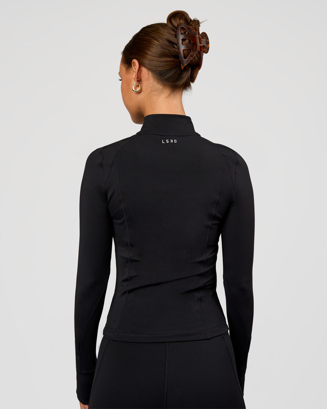 Woman wearing Fusion Active Jacket - Black | Model:Brylee | Size:XS