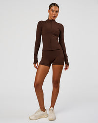 Woman wearing Fusion Active Jacket - Hot Chocolate | Model:Charli | Size:XS