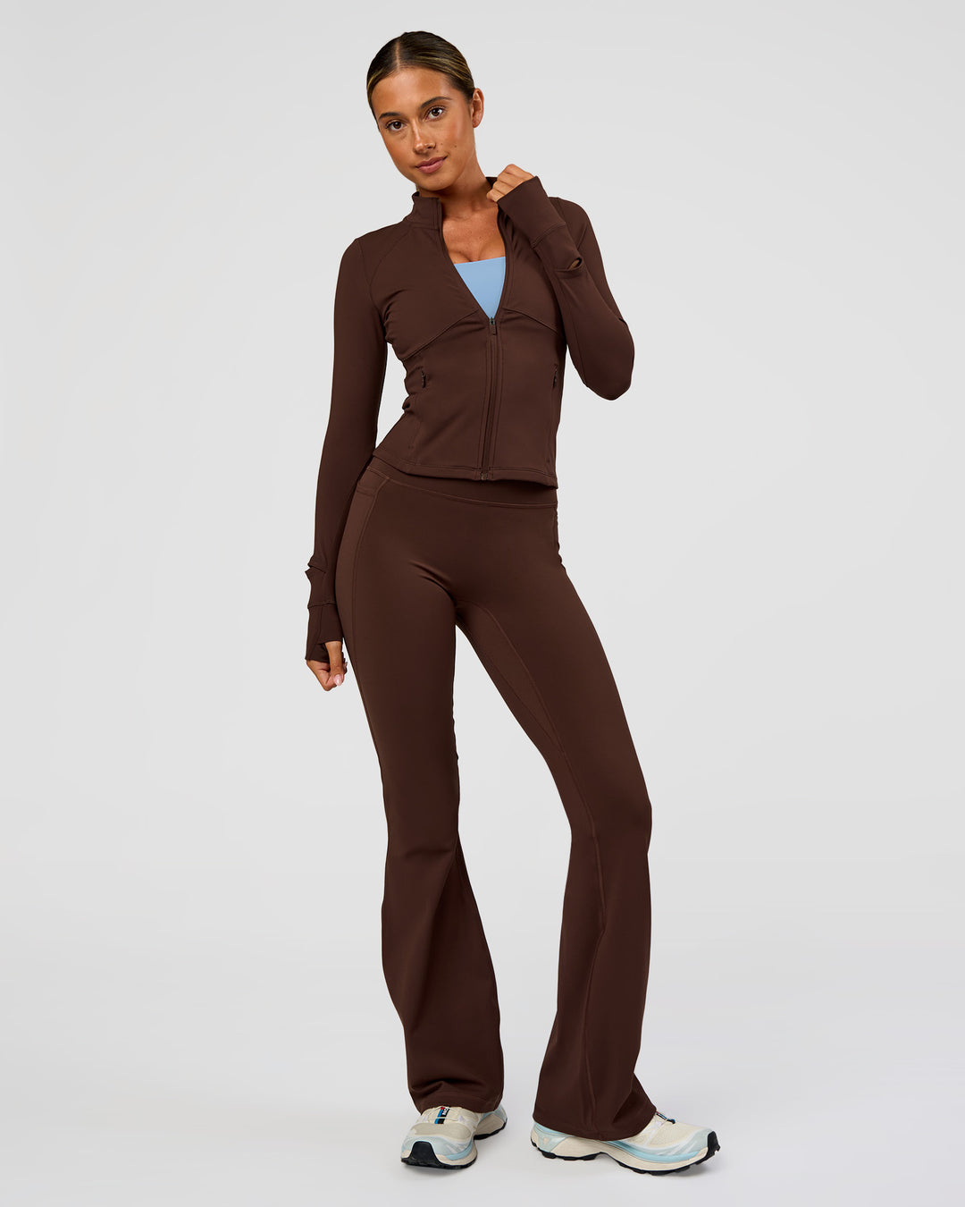 Woman wearing Fusion Active Jacket - Hot Chocolate | Model:Charli | Size:XS