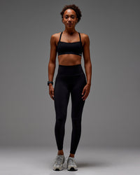 Woman wearing Fusion Ultra High-Rise Full Length Legging Pockets - Black | Model: Txai | Size:XS