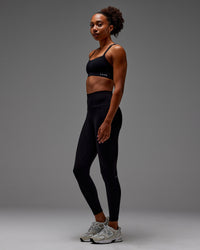 Woman wearing Fusion Ultra High-Rise Full Length Legging Pockets - Black | Model: Txai | Size:XS