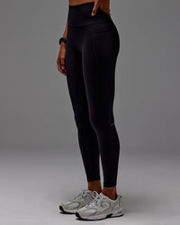 Woman wearing Fusion Ultra High-Rise Full Length Legging Pockets - Black | Model: Txai | Size:XS