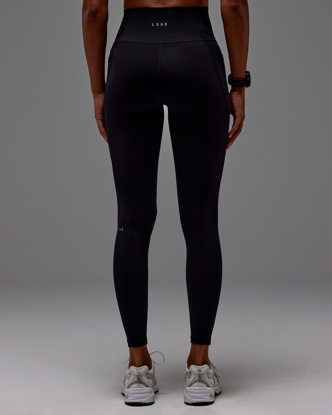 Woman wearing Fusion Ultra High-Rise Full Length Legging Pockets - Black | Model: Txai | Size:XS