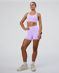 Woman wearing Fusion Sports Bra 2.0 - Pale Lilac | Model:Emelia | Size:XS