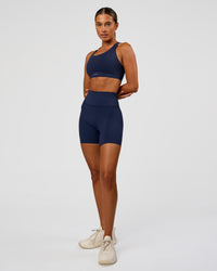 Woman wearing Fusion Sports Bra 2.0 - Future Navy | Model:Charlie | Size:S