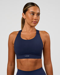 Woman wearing Fusion Sports Bra 2.0 - Future Navy | Model:Charlie | Size:S