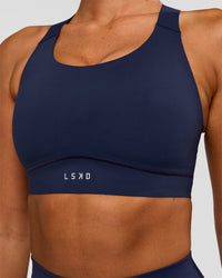 Woman wearing Fusion Sports Bra 2.0 - Future Navy | Model:Charlie | Size:S